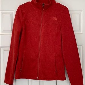The North Face red women’s zip up jacket